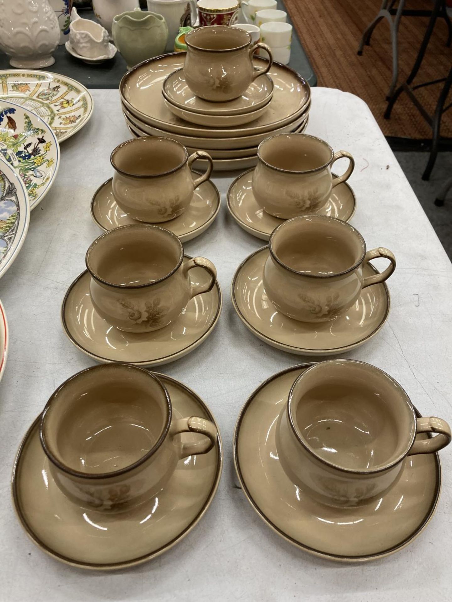 A QUANTITY OF DENBY PLATES, CUPS AND SAUCERS