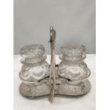 A SILVER PLATED HOLDER CONTAINING TWO GLASS STORAGE POTS