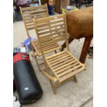 A PAIR OF NEW TEAK FOLDING GARDEN CHAIRS