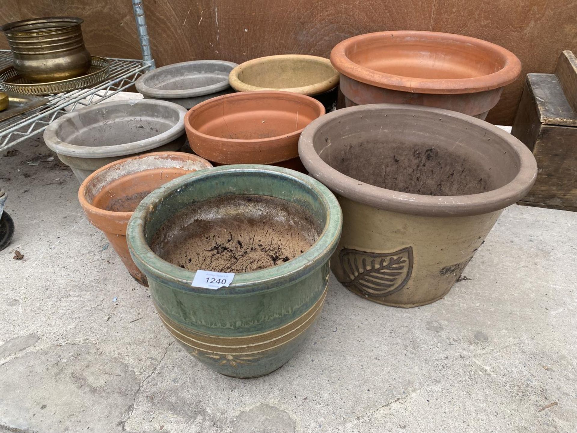 A LARGE ASSORTMENT OF TERACOTTA AND GLAZED GARDEN POTS