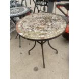 A ROUND TILE TOPPED CAST IRON BISTRO TABLE