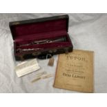 A BOXED BOOSEY AND HAWKES CLARINET 77 BOEHM SYSTEM WITH SPARE REEDS AND 'PRACTICAL TUTOR FOR THE