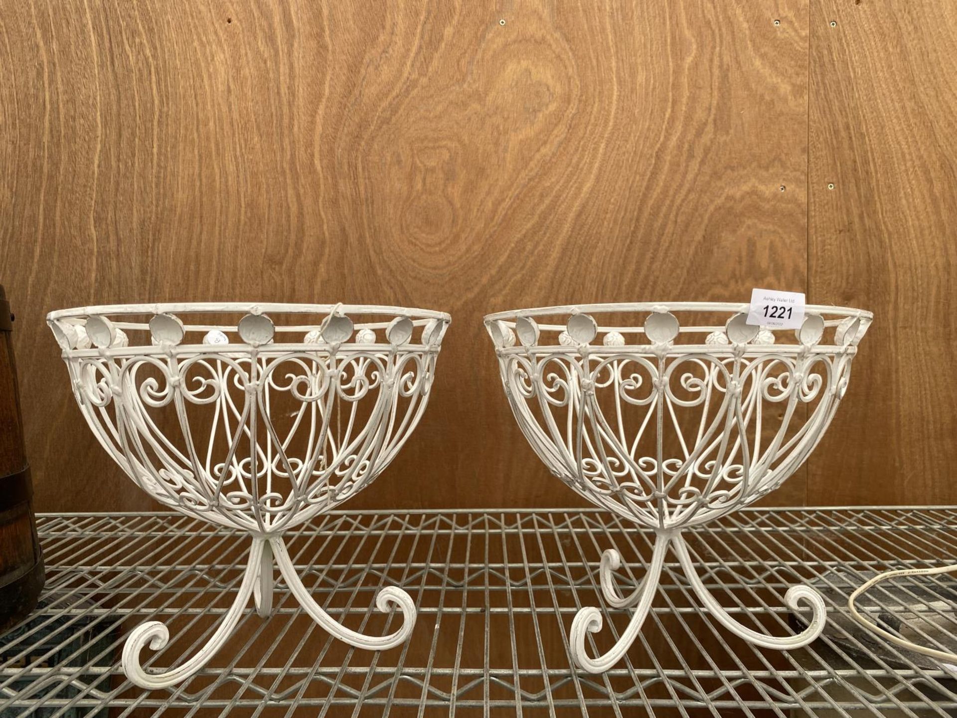 A PAIR OF DECORATIVE METAL PLANTERS