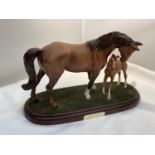 A ROYAL DOULTON MARE AND FOAL ON A PLINTH 'FIRST BORN'