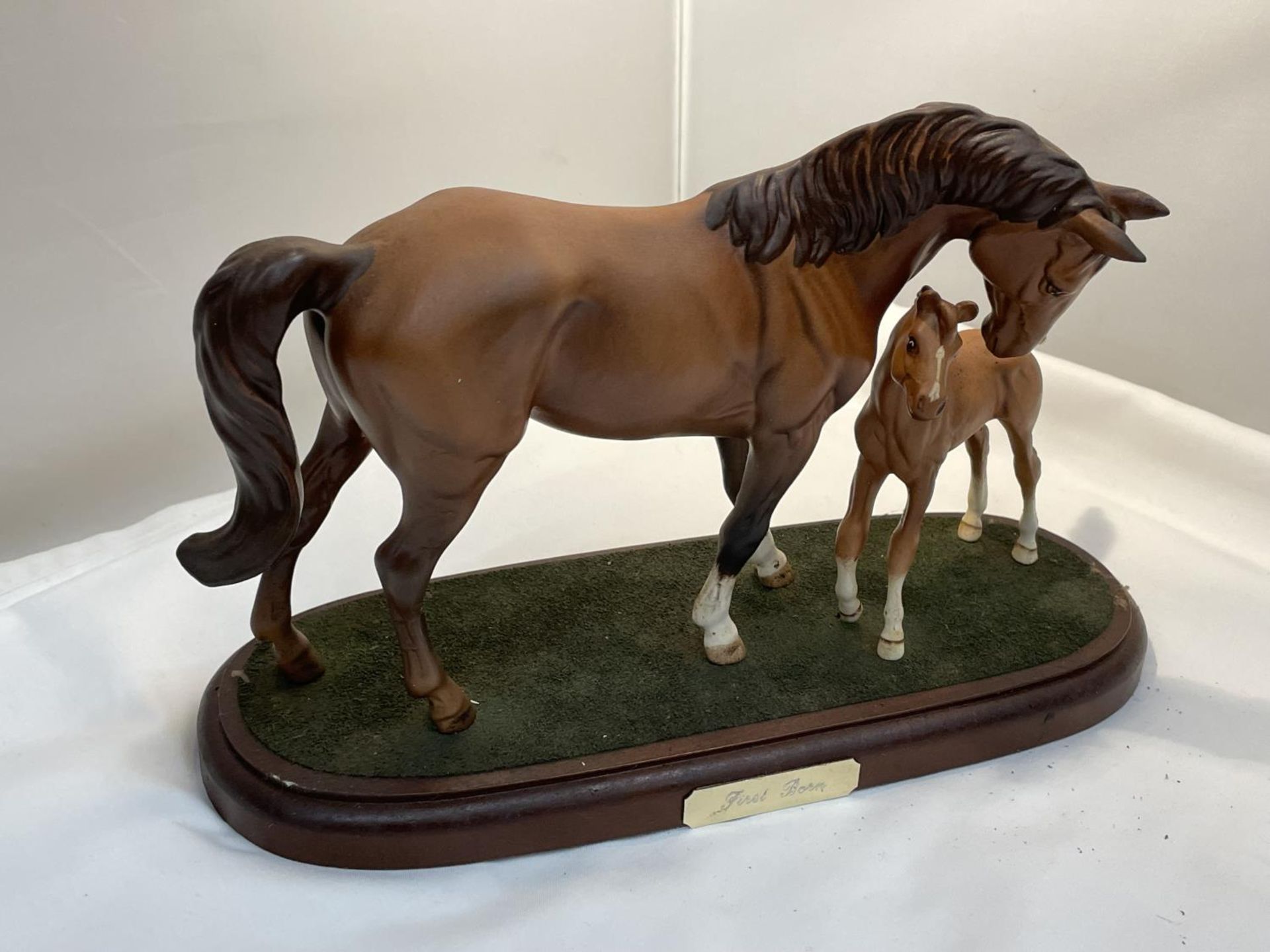 A ROYAL DOULTON MARE AND FOAL ON A PLINTH 'FIRST BORN'