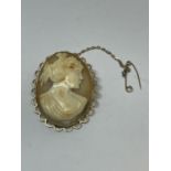 A CAMEO BROOCH WITH A 9 CARAT GOLD SURROUND AND SAFETY CHAIN