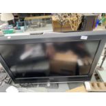 A TOSHIBA 32" TELEVISION WITH REMOTE CONTROL
