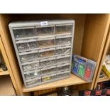 A TWELVE SECTION HARDWARE STORAGE UNIT WITH AN ASSORTMENT OF HARDWARE