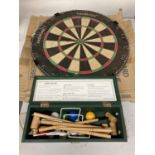 A THURSTON HEAVY VINTAGE DARTS BOARD AND A MINI BOXED CROQUET SET