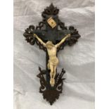 A FRENCH DEPICTION OF CHRIST ON A CARVED MAHOGANY CROSS A/F, HEIGHT 52.5CM