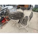 A WOODEN SLATTED GARDEN BISTRO SET WITH ROUND TABLE AND TWO CHAIRS