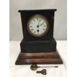 A VINTAGE CHIME MANTLE CLOCK WITH KEY AND PENDULUM