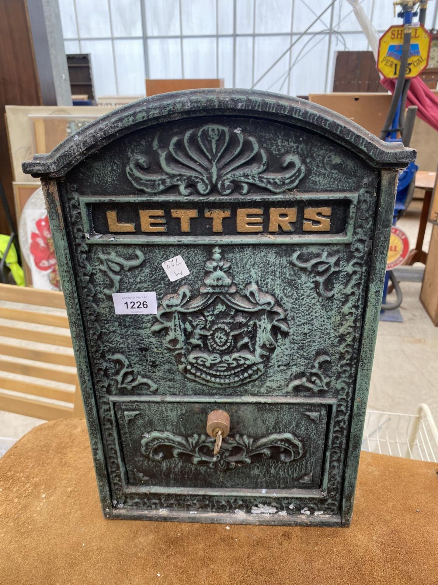 A METAL WALL MOUNTED LETTER BOX
