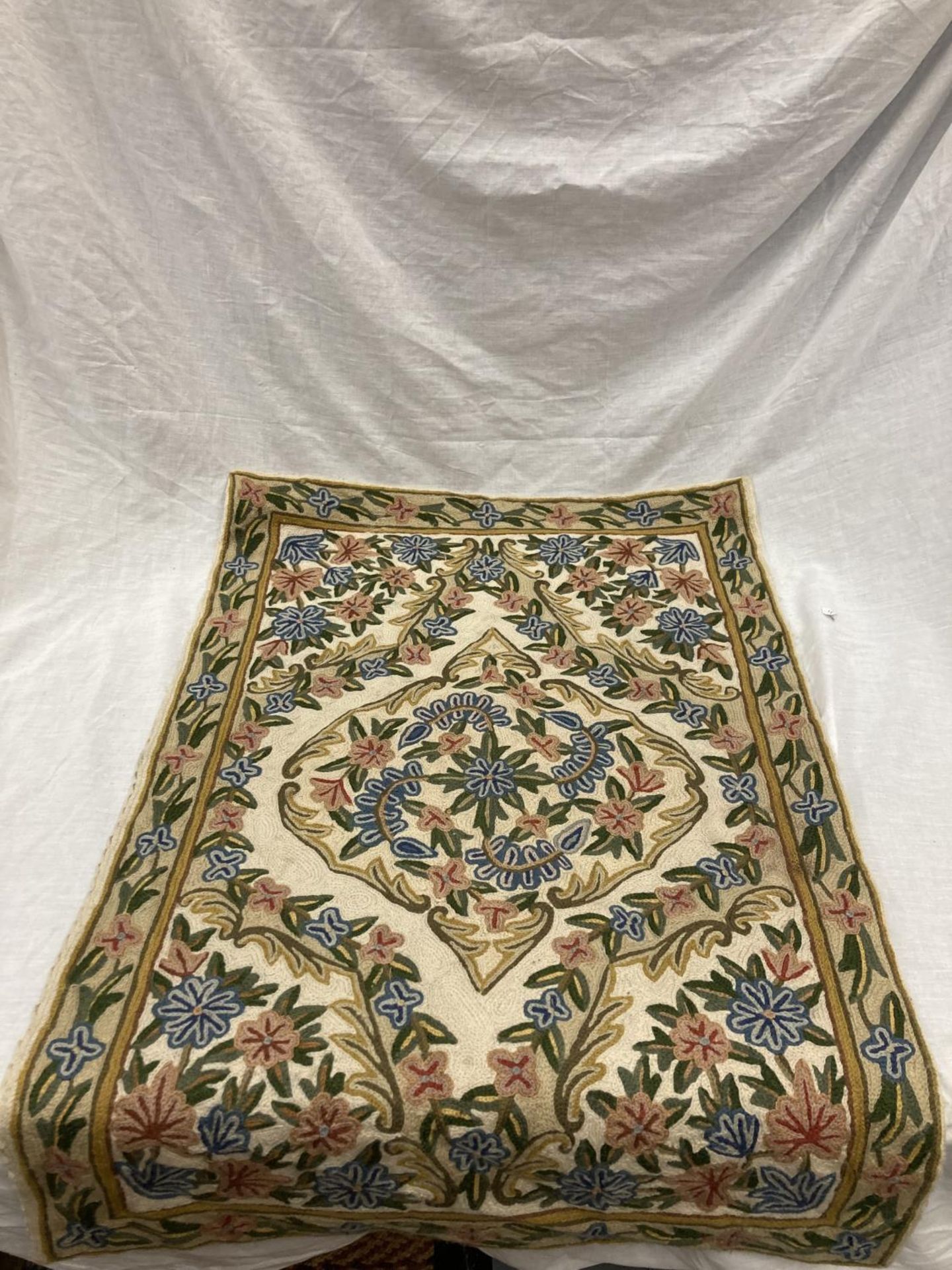 A KASHMIRI HAND STITCHED WOOL CHAIN RUG 86CM X 58CM