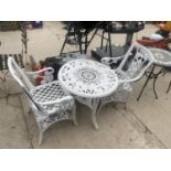 A PLASTIC DECORATIVE BISTRO SET WITH A ROUND TABLE AND TWO CHAIRS