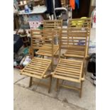 A SET OF FOUR NEW FOLDING TEAK GARDEN CHAIRS