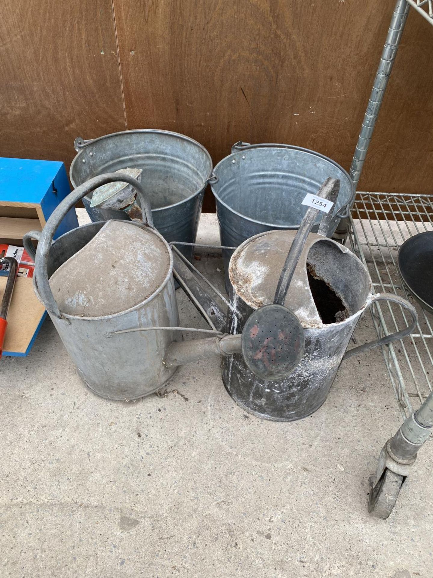 TWO VINTAGE GALVANISED WATERING CANS AND TWO GALVANISED BUCKETS