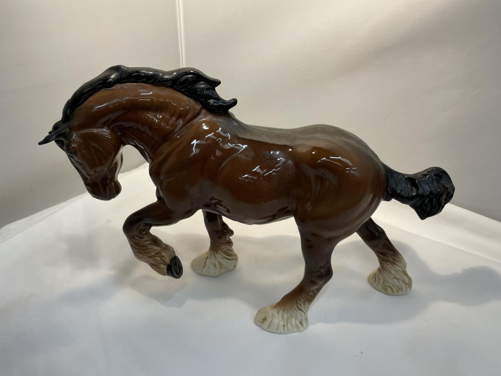 A ROYAL DOULTON GLOSS BAY PRANCING SHIRE HORSE