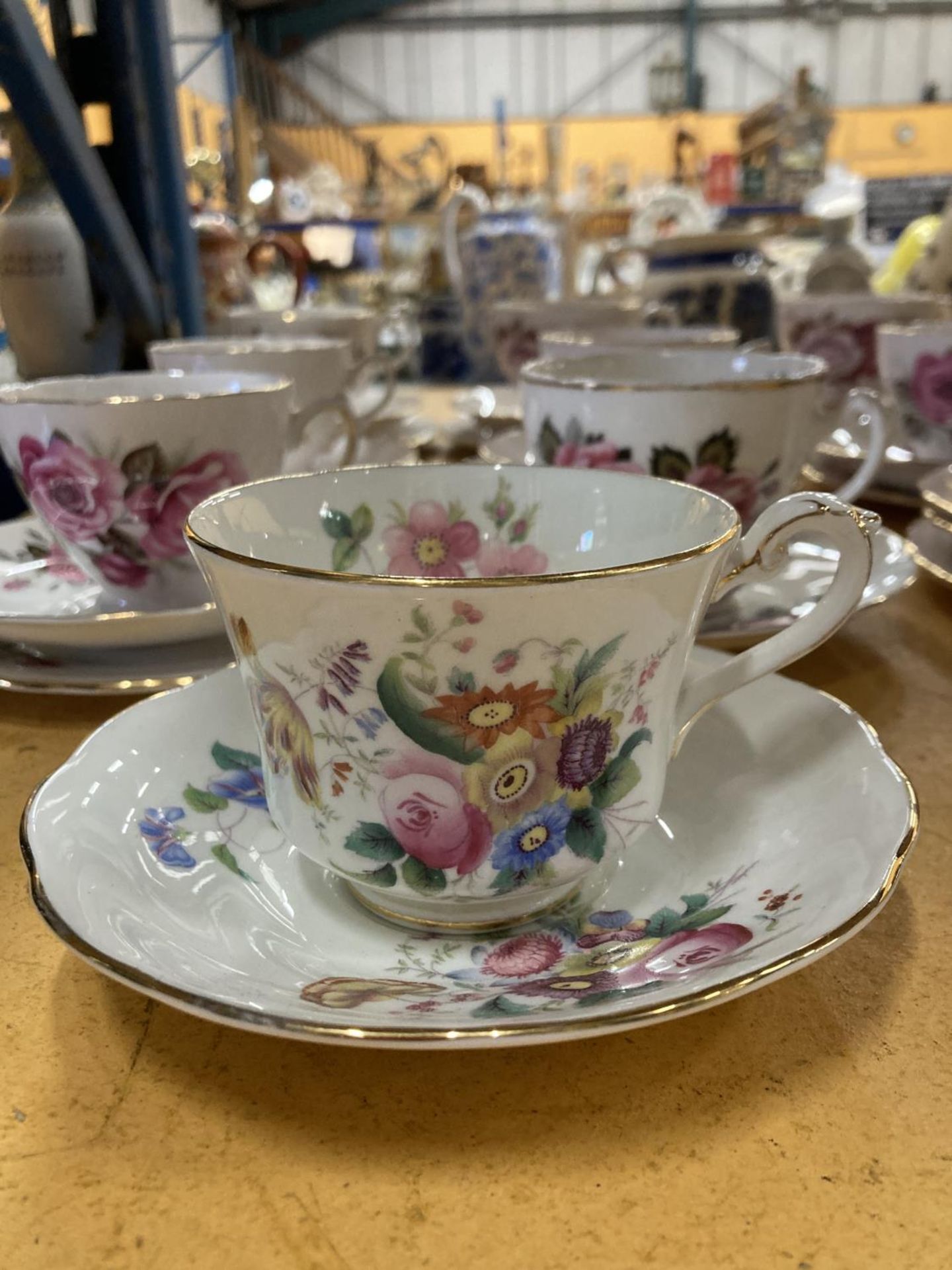 A QUANTITY OF BONE CHINA 'ROSE' PATTERNED TRIOS PLUS A COALPORT 'JUNETIME' CUP AND SAUCER AND A - Image 2 of 8