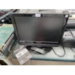A TECHNIKA 19" TELEVISION WITH REMOTE CONTROL