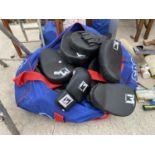 AN ASSORTMENT OF BOXING GLOVES AND PADS