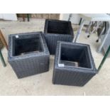 THREE SQUARE RATTAN PLANTERS WITH PLASTIC INSERTS