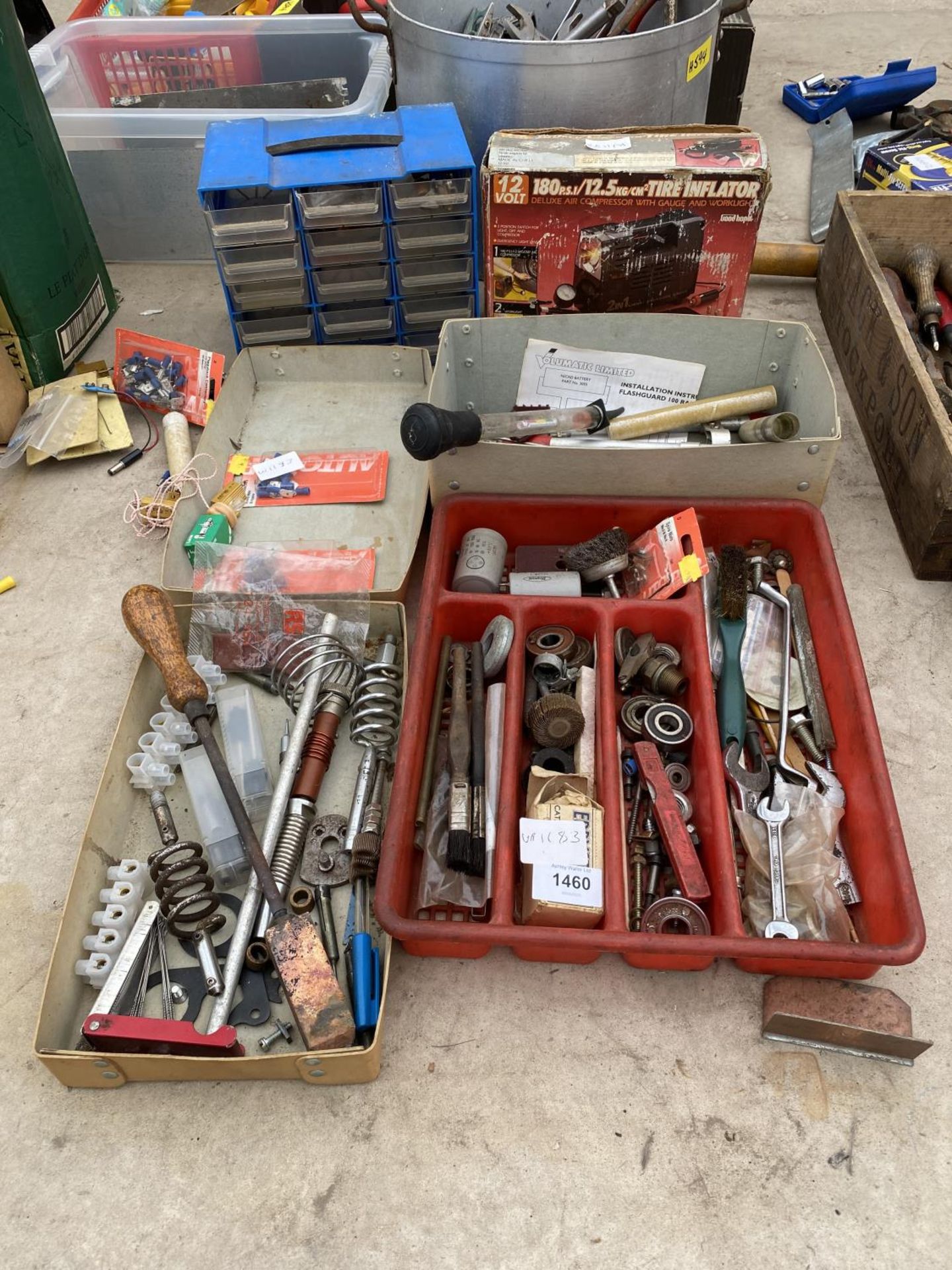 AN ASSORTMENT OF TOOLS AND HARDWARE TO INCLUDE SMALL BEARINGS AND A TYRE INFLATOR ETC