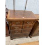 AN ANTIQUE STYLE WALNUT CROSSBANDED AND INLAID TV CABINET, 28" WIDE, IN THE FORM OF A CHEST OF