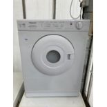 A SMALL WHITE 3KG REVERSOMATIC DRYER