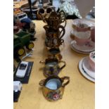 A QUANTITY OF BRONZE COLOURED FLORAL PATTERNED GRADUATING JUGS PLUS A TEAPOT