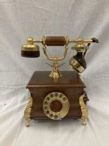 A VINTAGE STYLE OAK TELEPHONE WITH BRASS DETAILING