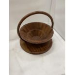 A METAMORPHIC WOODEN TRAY, PULL THE HANDLE UP AND IT BECOMES A BASKET