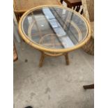 A BAMBOO AND WICKER COFFEE TABLE WITH GLASS TOP, 26" DIAMETER