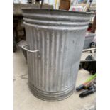 A GALVANISED DUST BIN/PLANTER