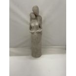 A STONEWARE FIGURINE OF A MAN HOLDING A PREGNANT LADY HEIGHT 38CM