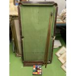A TABLE TOP POOL TABLE WITH INTACT ORIGINAL POCKETS, SET OF BALLS, SCOREBOARD AND THREE CUES 60CM