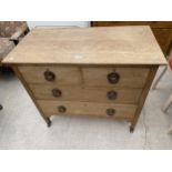AN OAK ART NOUVEAU CHEST OF TWO SHORT AND TWO LONG DRAWERS, 36" WIDE, WITH COPPERISED HANDLES