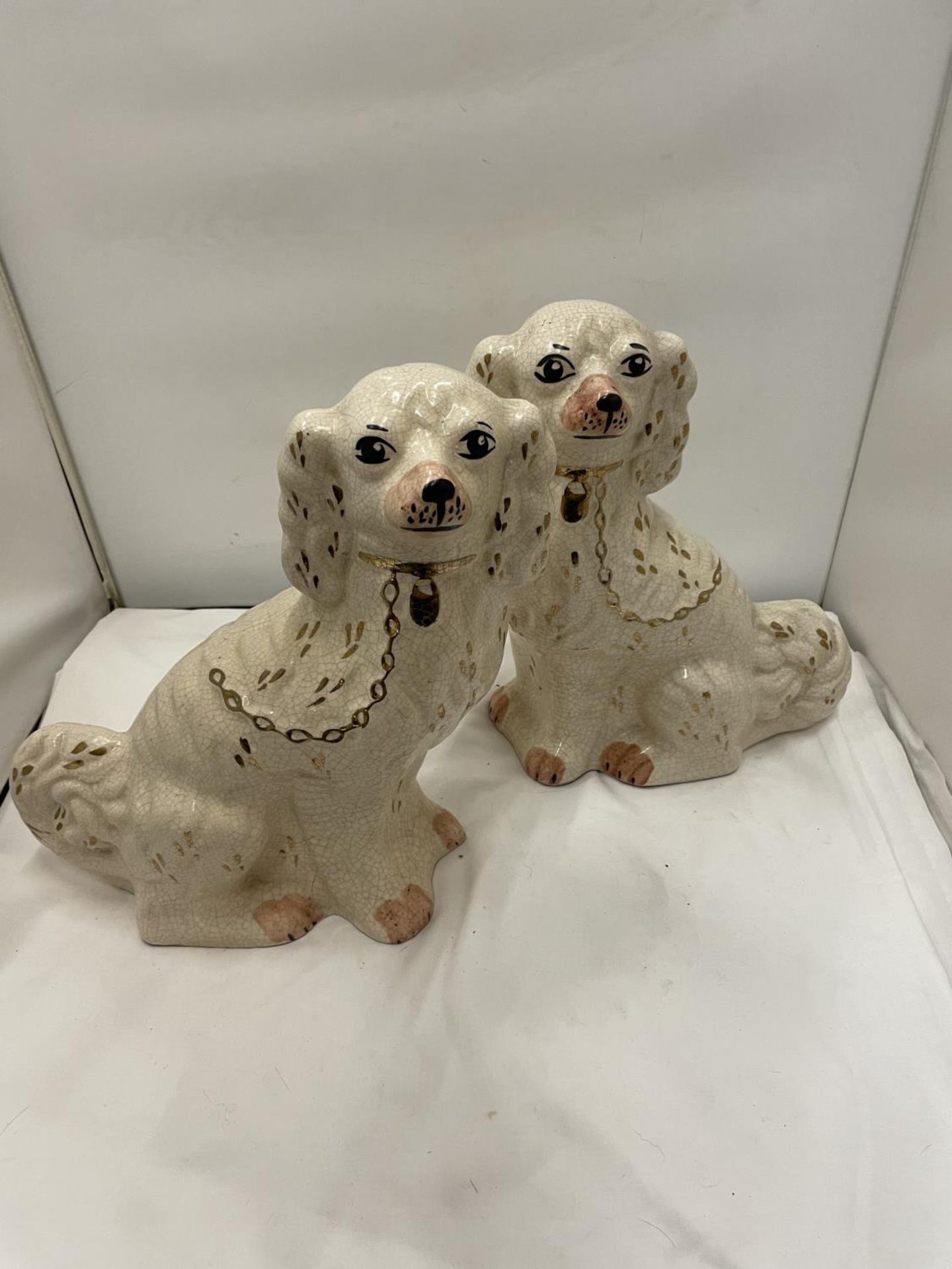 A PAIR OF STAFFORDSHIRE MANTLE DOGS HEIGHT 33CM