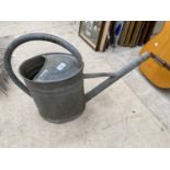 A VINTAGE GALVANISED WATERING CAN