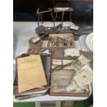 A LARGE QUANTITY OF VINTAGE LABORATORY EQUIPTMENT TO INCLUDE TEST TUBES, TEST TUBE HOLDERS, CLAMPS