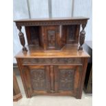 A JACOBEAN STYLE OAK COURT CUPBOARD WITH CARVINGS TO THE DOORS AND PANELS, 42" WIDE