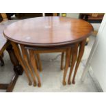 A NEST OF THREE YEW WOOD TABLES