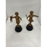 TWO METAL FIGURES OF CLASSICAL CHILDREN ON WOODEN PLINTHS HEIGHT 28CM