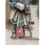 A LARGE ASSORTMENT OF GARDEN TOOLS TO INCLUDE A SHOVEL, RAKE AND BRUSHES ETC