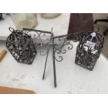 A PAIR OF METAL WALL HANGING CANDLE HOLDERS