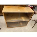 A RETRO TEAK BOOKCASE WITH FOUR SLIDING GLASS DOORS, 36" WIDE