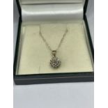 A 9 CARAT GOLD NECKLACE WITH DIAMOND PENDANT IN A PRESENTATION BOX