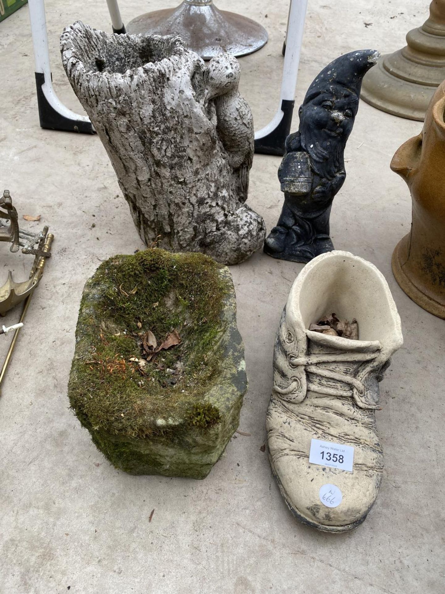 FOUR GARDEN ITEMS TO INCLUDE A GNOME, A BOOT PLANTER AND A SMALL STONE TROUGH ETC