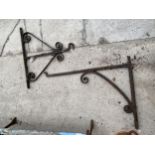 TWO VINTAGE WALL MOUNTED CAST IRON HANGING BRACKETS