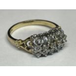 A 9 CARAT GOLD RING WITH FIFTEEN CUBIC ZIRCONIA STONES IN A CLUSTER DESIGN SIZE N